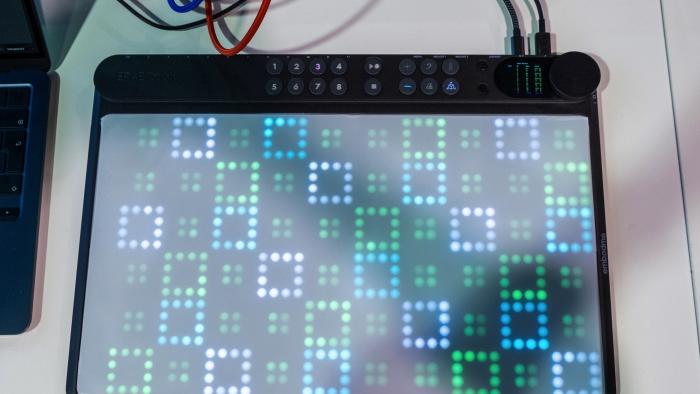 Terrence O'Brien playing the Embodme Erae II with one hand and taking a mediocre photo with the other at NAMM 2024.